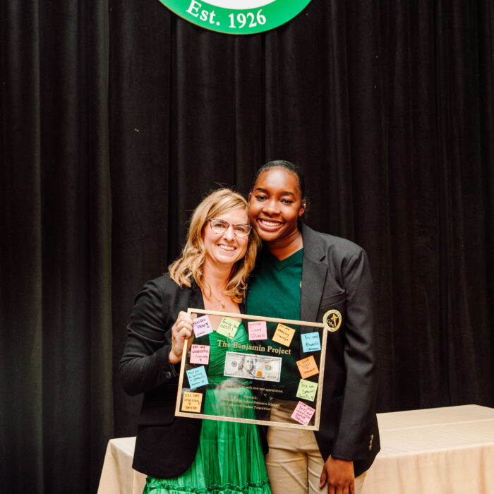 Cathedral scholar with Katie Sullivan presenting her with the a gift of appreciation for The Benjamin Project
